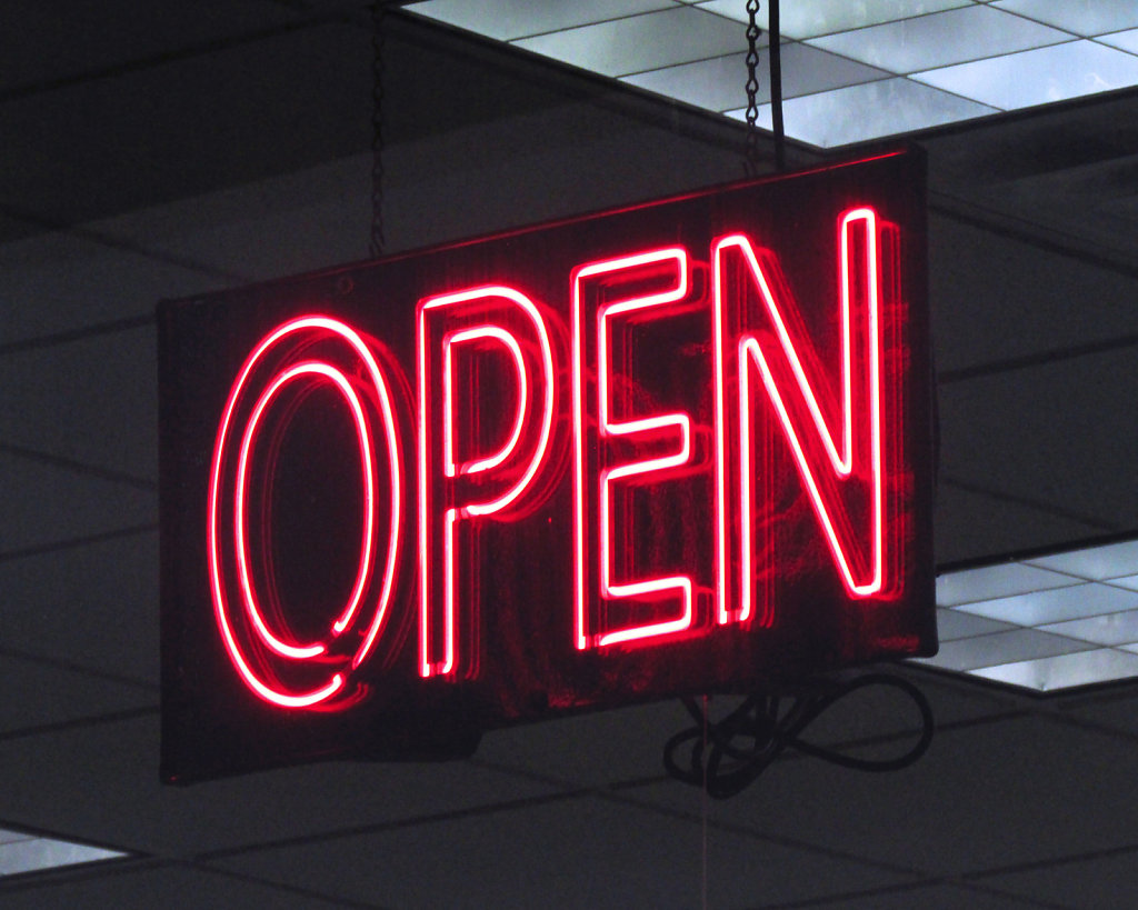 Neon red open for business sign