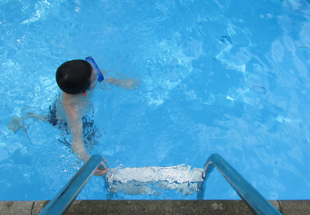 top view of kid swimming