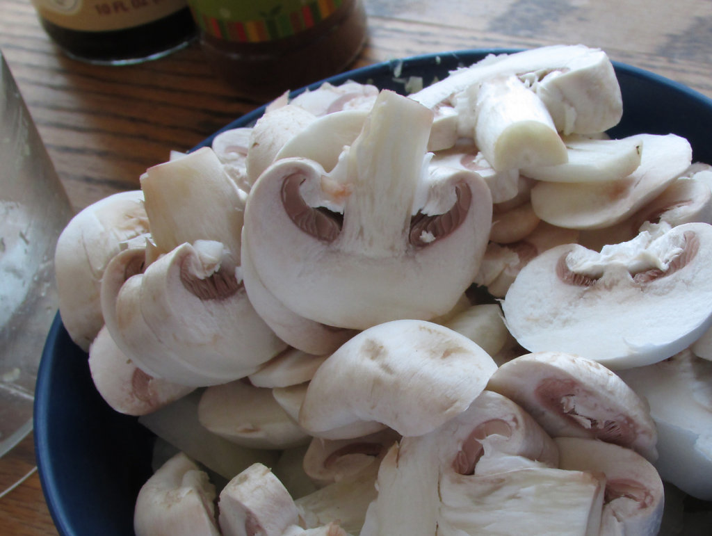Fresh sliced mushrooms in a bowl